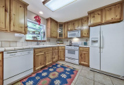 10-Knotty-pine-cabinetry-makes-this-kitchen-extra-cute-and-special